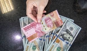 Nilai Tukar Rupiah Melemah Terhadap Dolar AS Akibat Sikap Kurang Dovish dari The Fed