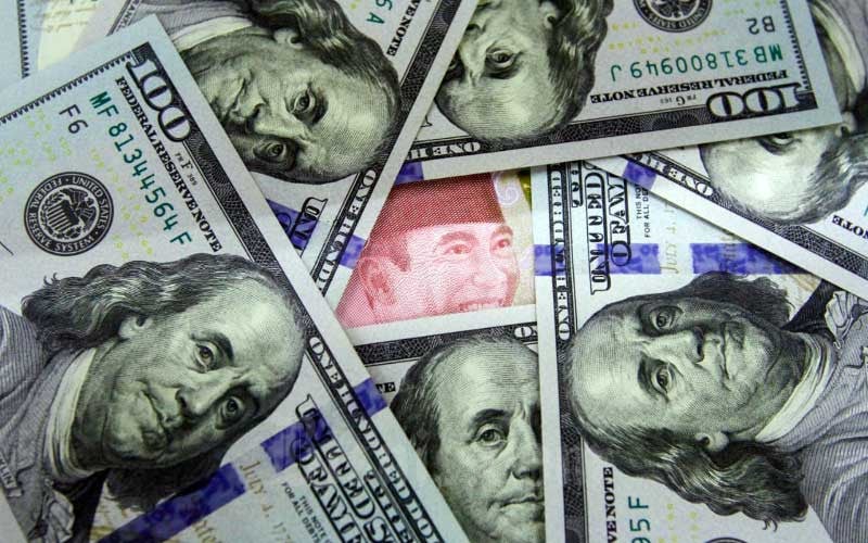 Nilai Tukar Rupiah Melemah Terhadap Dolar AS di Tengah Proyeksi Stabilnya Suku Bunga BI
