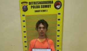 Pelaku diamankan petugas kepolisian.(Istimewa)
