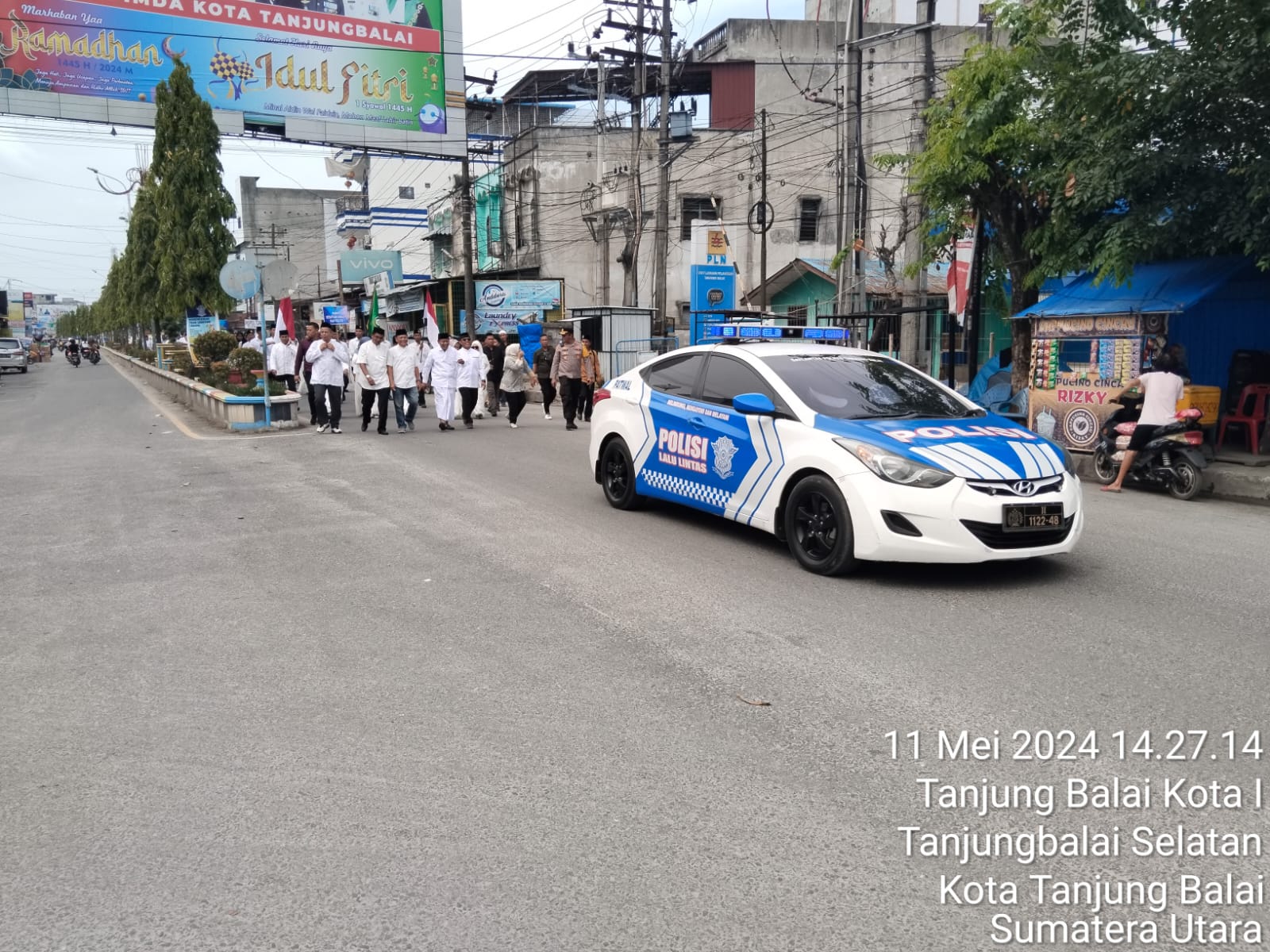 Petugas kepolisian mengawal kegiatan pawai.(Istimewa).