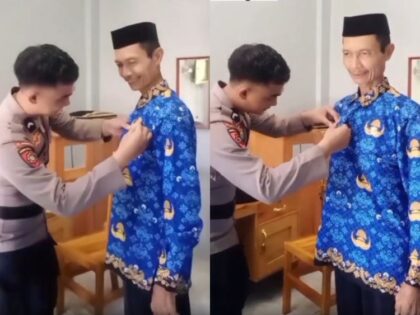 Momen Haru Guru MAN 1 Polman Dipasangkan Pin KORPRI oleh Mantan Muridnya yang Kini Jadi Polisi (Lambeturah.co.id)